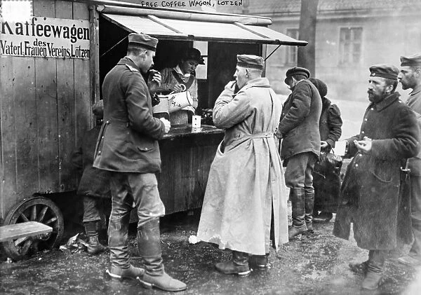 WORLD WAR I: COFFEE WAGON. German troops being served free coffee at a coffee wagon in Lotzen
