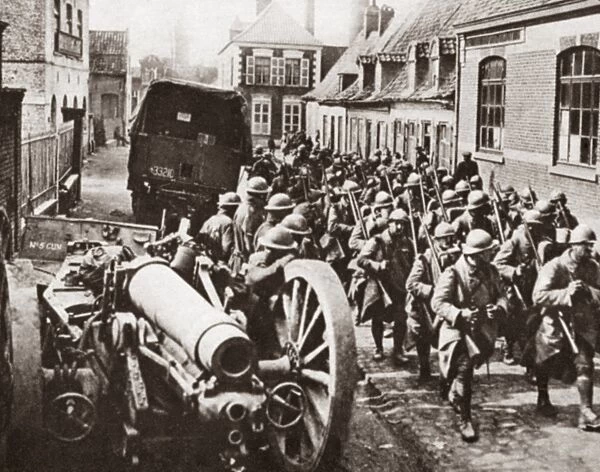 WORLD WAR I: FRENCH TROOPS. French troops marching through a village on the way