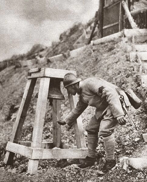 WORLD WAR I: GAS WARFARE. Soldier ringing a bell to warn of an imminent gas attack