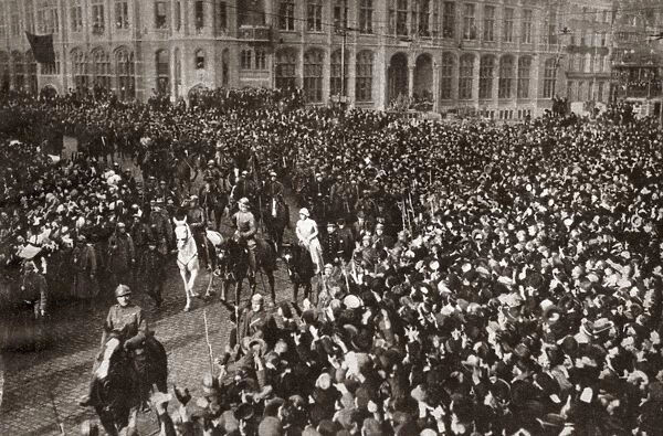 WORLD WAR I: GHENT, 1918. King Albert, Queen Elizabeth and Prince Leopold leading