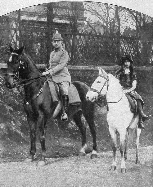 WORLD WAR I: OFFICER. A young Prussian officer riding with the daughter of a farmer in Lille