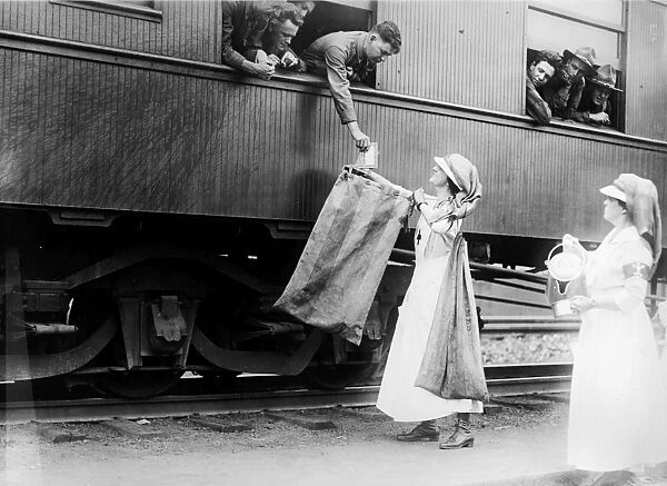 WORLD WAR I: RED CROSS. American Red Cross workers providing water and mail service at Union Station, Washington, D. C. c1918