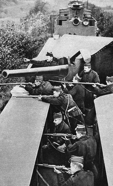 WORLD WAR I: SHARPSHOOTERS. Belgian sharpshooters firing at the enemy from an armored