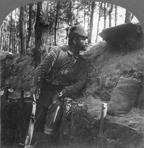 WORLD WAR I: SOLDIER. German soldier on watch from his trench on the Russian front Stereograph, 1916