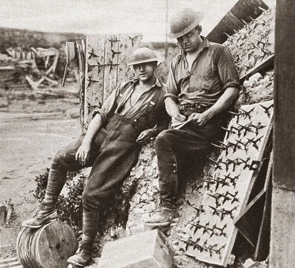 WORLD WAR I: SPIKED BOARDS. Allied soldiers posing with spiked boards laid by the