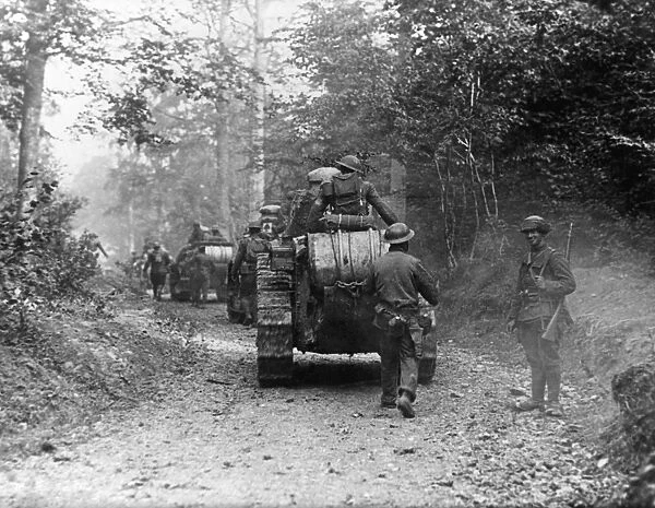 WORLD WAR I: TANK, c1917. Armored column advances down a forest road. Photograph