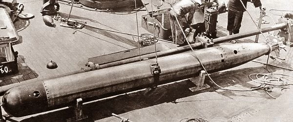 WORLD WAR I: TORPEDO. 21-inch torpedo being loaded onto the U