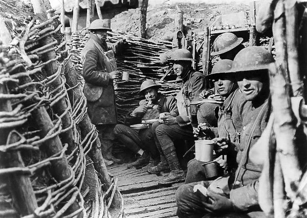 WORLD WAR I: U. S. TROOPS. Alabama troops of the 167th Infantry messing in a front line trench near Ancerviller, France, March 11, 1918