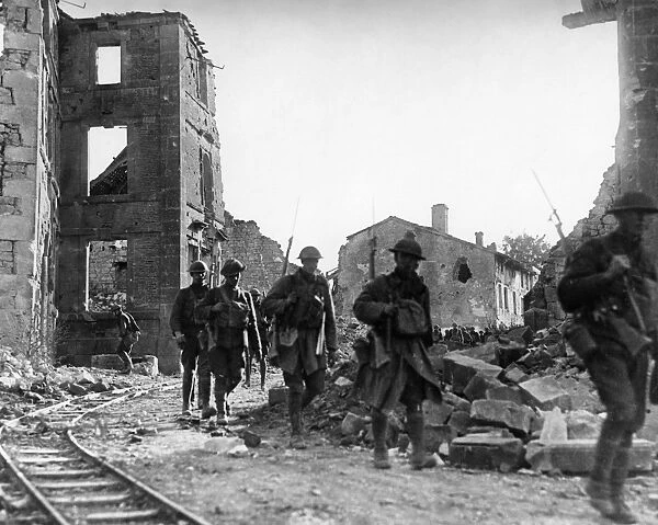 WORLD WAR I: U. S. TROOPS. U. S. troops marching through the ruins of a European