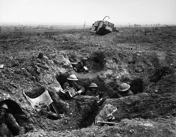 WORLD WAR I: YPRES, 1917. British troops in a gun-pit trench with a destroyed Mark