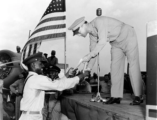WORLD WAR II: AWARD, c1943. Man receiving a military award, Tuskegee Army Air Field, Alabama