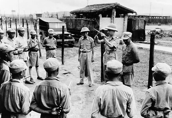 WORLD WAR II, c1942. Lieutenant Carl Arnold giving Chinese soldiers their first