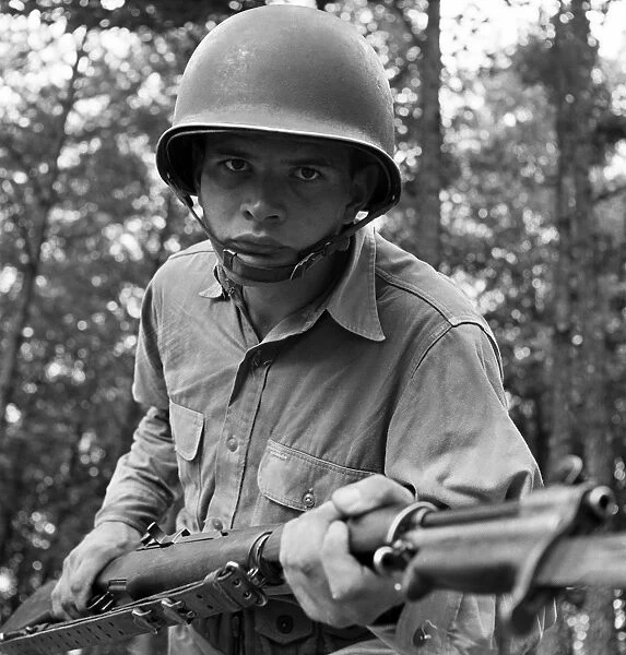 WORLD WAR II: SERGEANT, 1942. Sergeant George Camblair learning to use a bayonet while training at Fort Belvoir, Virginia. Photograph by Jack Delano, September 1942