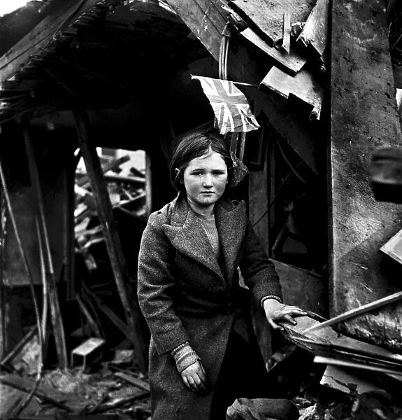 WORLD WAR II: V-2 ATTACK. A girl standing amid the ruins in Battersea, London, England