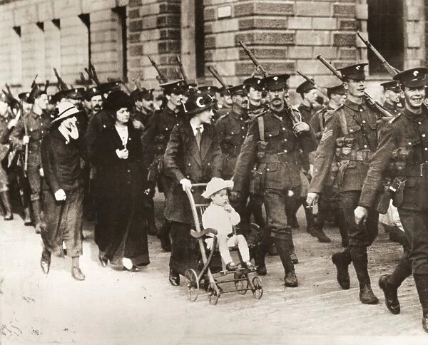 WORLD WAR Il: BRITISH ARMY. Women walking alongside British troops during World War I