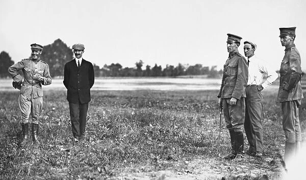 The Wright Brothers, Orville (1871-1948) and Wilbur (1867-1912). American pioneers in aviation. Left to right: Lieutenant Benjamin Foulois, Orville Wright, Lieutenant Frank P. Lahm, Wilbur Wright, and an unknown figure. Photographed in 1909