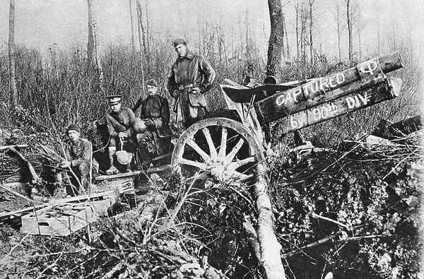 WWI: AMERICANS, 1918. American troops with a captured German gun during the last