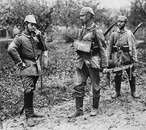 WWI: FIELD TELEPHONE. German telephone detachment laying field telephone wire during World War I
