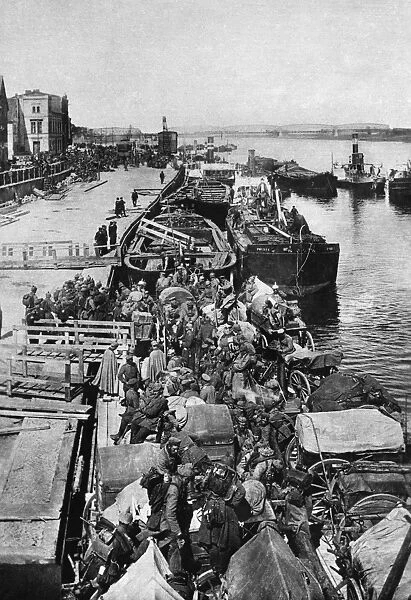 WWI: GERMAN TROOPS, c1914. The disembarkation of German troops from barges, somewhere in Europe
