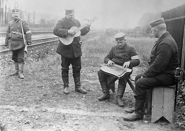 WWI: MUSICIANS, 1914. German soldiers playing musical instruments. Photograph, 1914