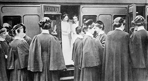 WWI: NURSES, c1914. English nurses getting on a train at London, England, during World War I