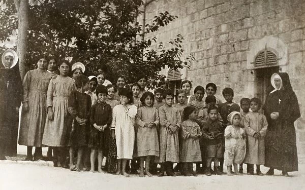 WWI: PALESTINE, 1918. Girls from Bethlehem who have received aid from the American