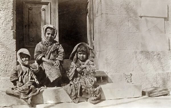 WWI: REFUGEES, 1919. Refugee children waiting to be received at the Jerusalem orphanage shelter