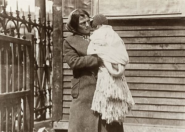 WWI REFUGEES, 1919. A refugee woman with her baby at an American Red Cross station