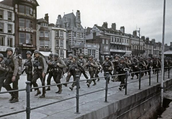 WWII: D-DAY, 1944. American troops in a British port town, preparing for the Allied