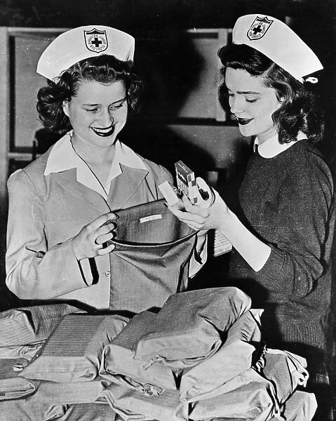 WWII: RED CROSS, c1942. Red Cross nurses preparing care packages for overseas troops