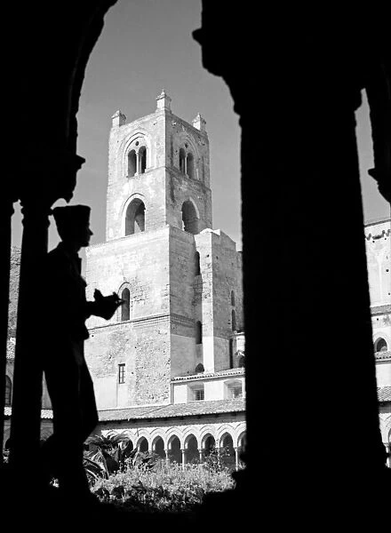 WWII: SICILY, 1943. An American soldier taking a photograph near the cathedral in Monreale