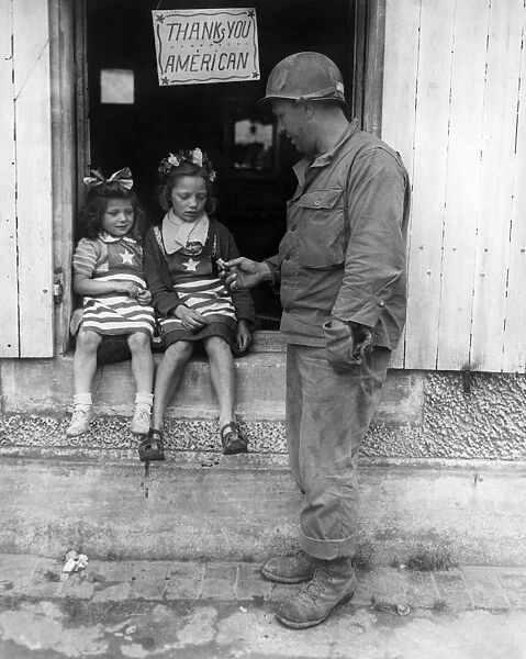 WWII: SOLDIER AND CHILDREN. American Sergeant Walter P