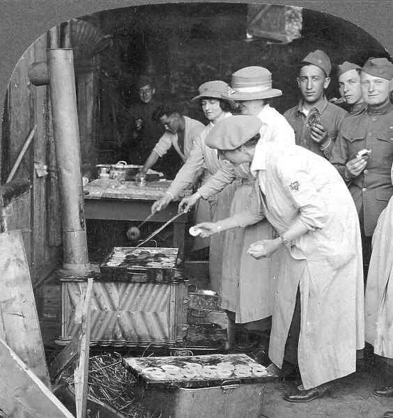 YMCA WOMEN WORKERS YMCA women making doughnuts for American doughboys at Montabaur on the Rhine: stereograph, 1918
