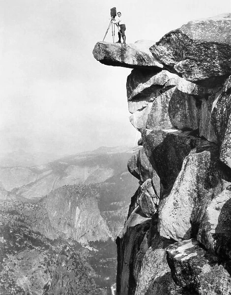 YOSEMITE: GLACIER POINT. William Henry Jackson photographing from a rock ledge