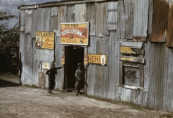 Young African American migrant workers outside a juke joint in Belle Glade, Florida. Photograph, 1941