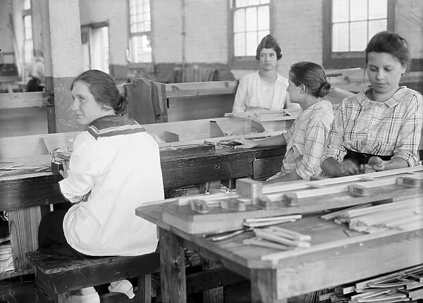 Young girls at work at the Alexandria Airplane Factory in Alexandria, Virginia. Photograph, 1918