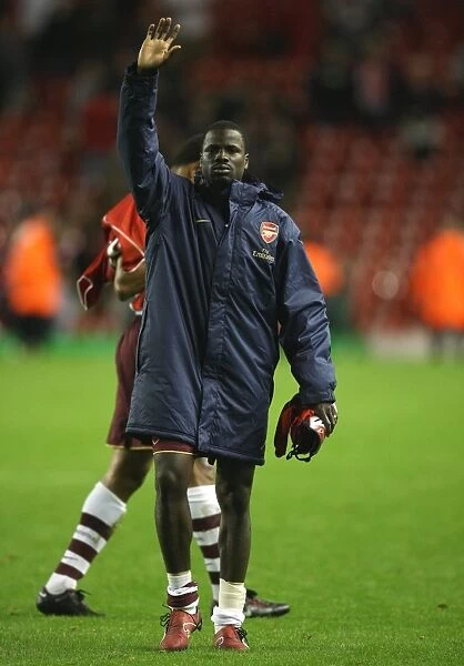 Emmanuel Eboue waves to the Arsenal fans after the match