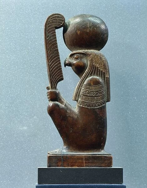 Ancient Egyptian figurine of sun god Ra in as falcon