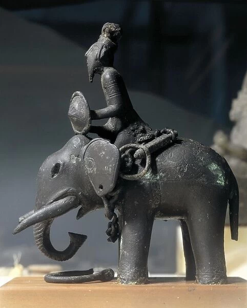 Egypt, Sculpture representing a soldier riding an elephant, bronze
