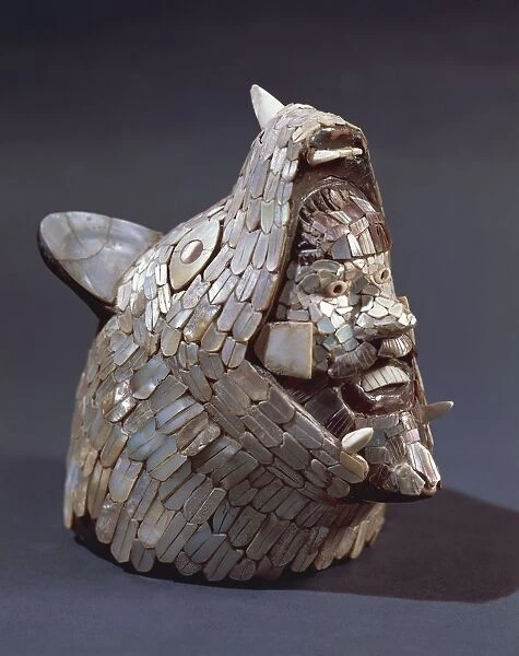 Figure depicting coyote with warriors head in its jaws, mother of pearl mosaic, from Tula