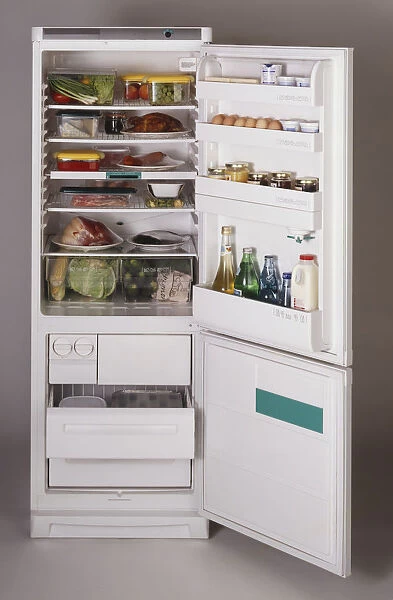 Fully-stocked fridge-freezer with its doors wide open, front view