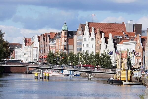 Germany, Schleswig-Holstein state, Lubeck city, view of medieval buildings and bridge over river Trave at the Old Town