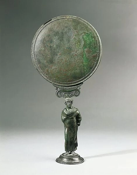 Italy, Calabria, Locri, Bronze mirror decorated with a statuette representing an ephebos (ephebe) wrapped in a cloak