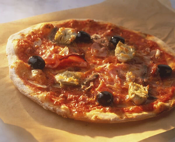 Pizza Siciliana, round pizza with light crispy crust, topped with artichokes, olives, ham and tomato sauce