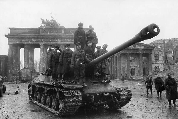 Red army soldiers aboard a joseph stalin (js2) tank at the brandenburg gates in berlin, germany at the end of world war 2, may 1945