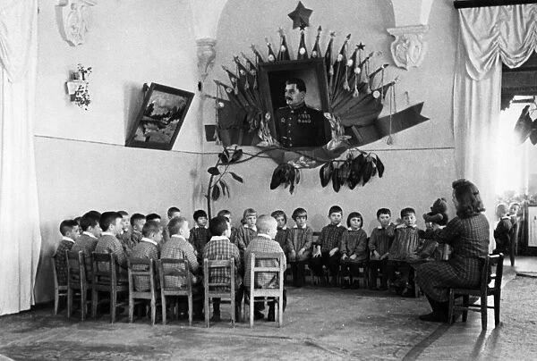 Students listening to their teacher tell a story at a kindergarten for miners children in the soviet union, 1948