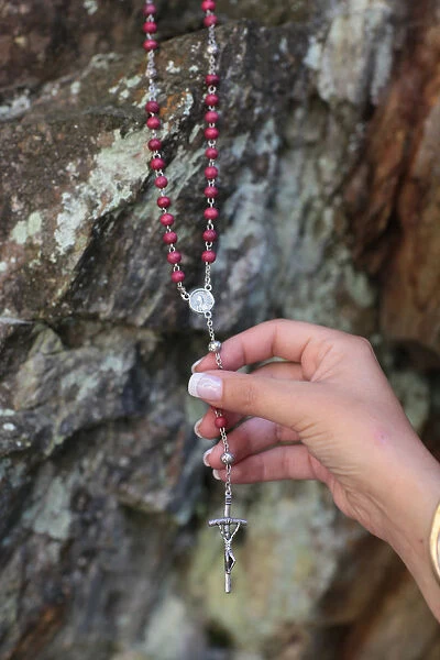Woman holding a rosary