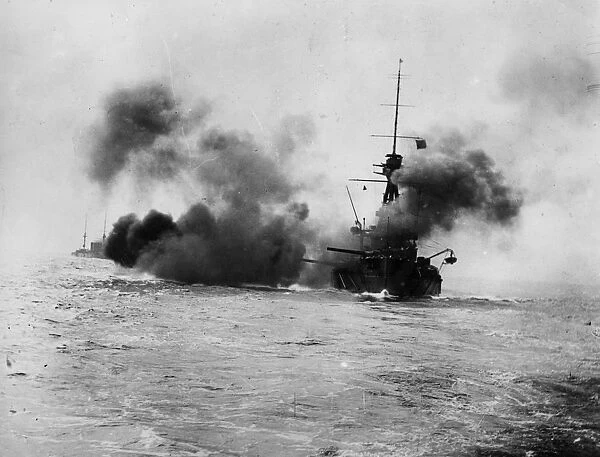 Broadside. circa 1914: HMS Collingwood firing a broadside