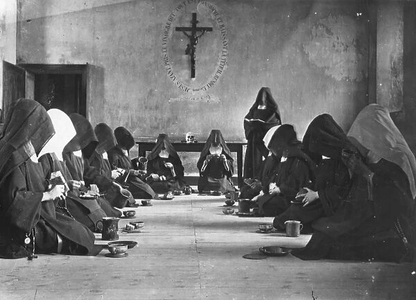 Meal Time. 1904: A nun reads at meal times to the assembled Carmellite