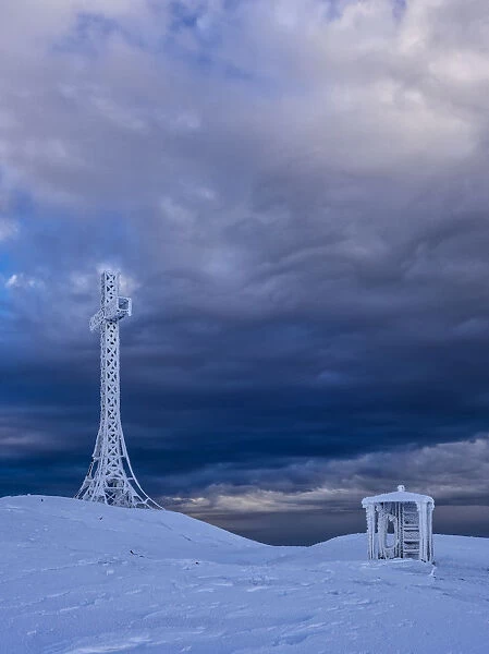 Summit cross and a small hut covered with hoarfrost, Monte Catria, Apennines, Marche, Italy